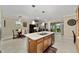 Open concept kitchen with large island, stainless steel appliances, and breakfast bar at 7067 Sw 91St Ct, Ocala, FL 34481