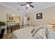 Bedroom with king-size bed, mirrored closet and hardwood floors at 7067 Sw 91St Ct, Ocala, FL 34481