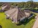 Single-story home with a screened-in patio and spacious yard at 7067 Sw 91St Ct, Ocala, FL 34481