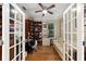 Home office with built-in shelving and French doors at 7067 Sw 91St Ct, Ocala, FL 34481
