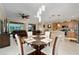Open concept dining area with kitchen and living room views at 7067 Sw 91St Ct, Ocala, FL 34481