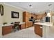 Modern kitchen with an island and built-in workspace at 7067 Sw 91St Ct, Ocala, FL 34481