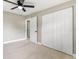 Light and airy bedroom featuring laminate wood flooring and double door closet at 1014 Caroline Ave, Auburndale, FL 33823