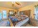 King-size bed, dresser, and view of the pool from the bedroom at 7291 Remington Oaks Dr, Lakeland, FL 33810