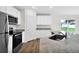 Modern kitchen with granite countertops and stainless steel appliances at 176 Marion Oaks Ln, Ocala, FL 34473