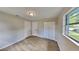 Bright bedroom with wood-look floors and ample closet space at 1737 Jacobs Rd, South Daytona, FL 32119