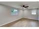 Bright bedroom with neutral walls and wood-look tile flooring at 1737 Jacobs Rd, South Daytona, FL 32119