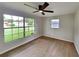 Spacious bedroom featuring a large window and ceiling fan at 1737 Jacobs Rd, South Daytona, FL 32119