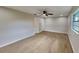 Well-lit bedroom featuring neutral decor and wood-look tile floors at 1737 Jacobs Rd, South Daytona, FL 32119