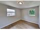 Simple bedroom with neutral walls and wood-look tile floors at 1737 Jacobs Rd, South Daytona, FL 32119