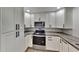 Modern kitchen with white shaker cabinets and sleek countertops at 1737 Jacobs Rd, South Daytona, FL 32119