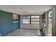 Cozy screened porch, ideal for relaxing and enjoying the outdoors at 1737 Jacobs Rd, South Daytona, FL 32119