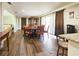 Bright dining room with a large table and hardwood floors at 1140 E George St, Bartow, FL 33830