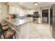 Galley kitchen with granite countertops and stainless steel appliances at 1140 E George St, Bartow, FL 33830