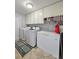 Laundry room with washer, dryer, and extra storage at 1140 E George St, Bartow, FL 33830