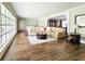 Large living room with tile floors and sectional sofa at 1140 E George St, Bartow, FL 33830