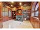 Library featuring a fireplace and custom built-ins at 9202 Bay Point Dr, Orlando, FL 32819