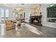 Spacious living room with fireplace and water views at 9202 Bay Point Dr, Orlando, FL 32819