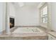 Relaxing bathroom with soaking tub and fireplace at 9202 Bay Point Dr, Orlando, FL 32819