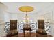 Upstairs sitting area with two ornate chairs and a lovely view at 9202 Bay Point Dr, Orlando, FL 32819