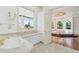 Elegant bathroom with marble vanity and water views at 9202 Bay Point Dr, Orlando, FL 32819