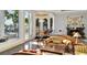 Living room with fireplace and large windows at 9202 Bay Point Dr, Orlando, FL 32819