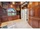 Elegant library with built-in bookshelves and hardwood flooring at 9202 Bay Point Dr, Orlando, FL 32819