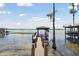 Covered dock with walkway leading to the lake at 9202 Bay Point Dr, Orlando, FL 32819