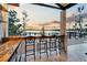 Enjoy sunset views from this outdoor bar with seating for three at 9202 Bay Point Dr, Orlando, FL 32819