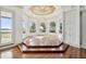 Bright sunroom with hardwood floors and water views at 9202 Bay Point Dr, Orlando, FL 32819