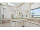 Bathroom with double vanity and a large mirror at 9202 Bay Point Dr, Orlando, FL 32819