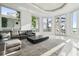 Sun-drenched living room with ample seating and access to a patio at 9202 Bay Point Dr, Orlando, FL 32819