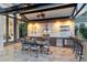 Gorgeous outdoor kitchen with granite counters and high-end appliances at 9202 Bay Point Dr, Orlando, FL 32819