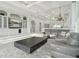 Spacious living area with a large sectional sofa and built-in entertainment center at 9202 Bay Point Dr, Orlando, FL 32819