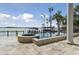 Resort-style pool and patio with fire pit overlooking the lake at 9202 Bay Point Dr, Orlando, FL 32819