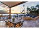 Spacious patio with seating area, overlooking the serene lake at 9202 Bay Point Dr, Orlando, FL 32819
