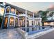 Elegant home with a beautiful pool and outdoor kitchen, perfect for entertaining at 9202 Bay Point Dr, Orlando, FL 32819