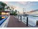 Long dock extends to the lake with beautiful sunset views at 9202 Bay Point Dr, Orlando, FL 32819