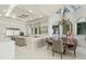Gourmet kitchen boasts expansive island, stainless steel appliances, and ample cabinetry at 9202 Bay Point Dr, Orlando, FL 32819