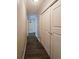 Long hallway with light walls and wood-look flooring at 1140 E George St, Bartow, FL 33830