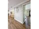 Bright hallway with wood flooring and access to other rooms at 1140 E George St, Bartow, FL 33830