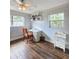 Cozy bedroom with a desk and plenty of natural light at 1140 E George St, Bartow, FL 33830