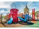 Another view of the community playground with slides and play structures at 2174 Fleming Mist Pl, Kissimmee, FL 34747