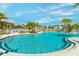 Resort-style pool with lounge chairs and tropical landscaping at 2174 Fleming Mist Pl, Kissimmee, FL 34747
