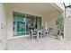 Covered patio with dining set and pool view at 2174 Fleming Mist Pl, Kissimmee, FL 34747