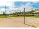 Community volleyball court with sand surface and net at 2174 Fleming Mist Pl, Kissimmee, FL 34747