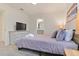 Bedroom with a queen bed and en-suite bathroom at 2174 Fleming Mist Pl, Kissimmee, FL 34747