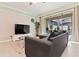Living room with comfortable seating and large TV at 2174 Fleming Mist Pl, Kissimmee, FL 34747