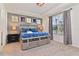 Bright bedroom with king-size bed and ensuite bathroom at 2174 Fleming Mist Pl, Kissimmee, FL 34747