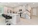 Modern kitchen with an island and stainless steel appliances at 2174 Fleming Mist Pl, Kissimmee, FL 34747